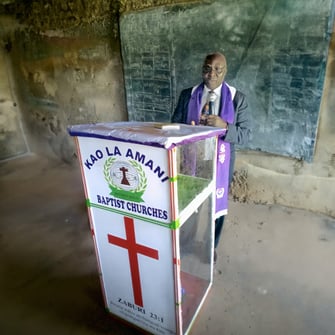 Rev. Amwayi at his church, Kao La Amani Baptist Church